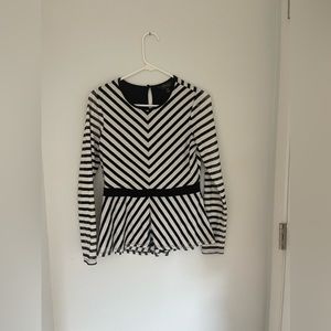 Black and white netted peplum top. Body of top is lined.